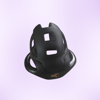 A view of the chastity cage sitting on its base ring, the breathable cut out air holes can be seen.