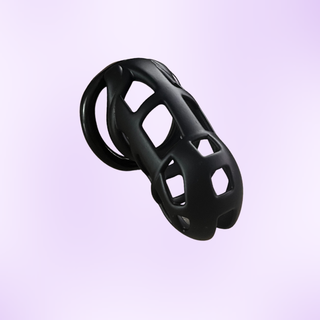 An angled view of the black chastity cage in standard size
