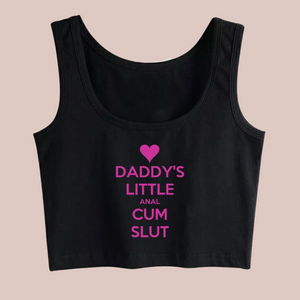 The black crop top, sleeveless t-shirt with Daddy's Little Anal Cum Slut printed in pink