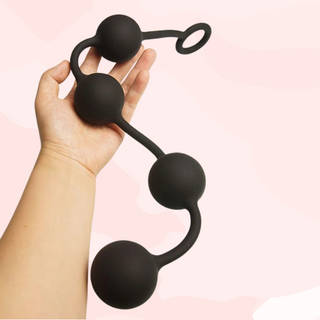 The anal beads are on a one piece silicone string, with the spaced beads and loop handle.