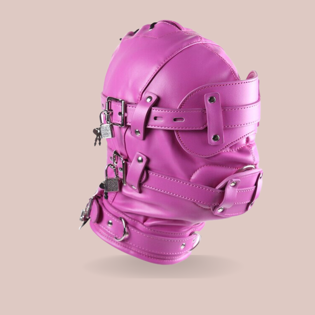 The Fetish Hood from House Of chastity shown from a side view fully assembled/ The hood is assembled, the eye mask and dildo gag are in place and locks affixed.