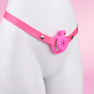 The chastity cage is shown in pink and is shown attached to a matching pink chastity belt. Belt available separately.