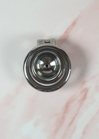 The rear view of the fully assembled chastity cage, you can see the inside of the urethral cup.