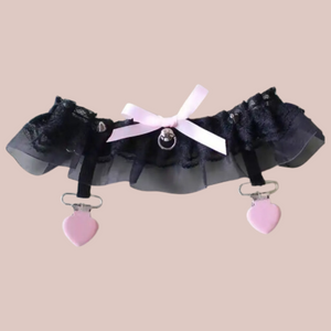 The black gauze and lace garter, you can see the pink accents.