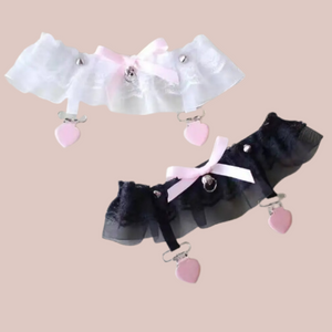 A full view of the frilled gauze and lace garter belt, you can see the studs and garter clips.