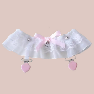 The white gauze and lace garter, you can see the pink accents.