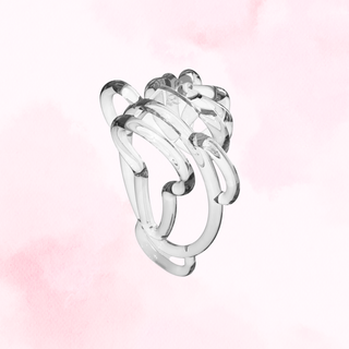 The rear view of the Fufu clip in transparent on a soft pink background