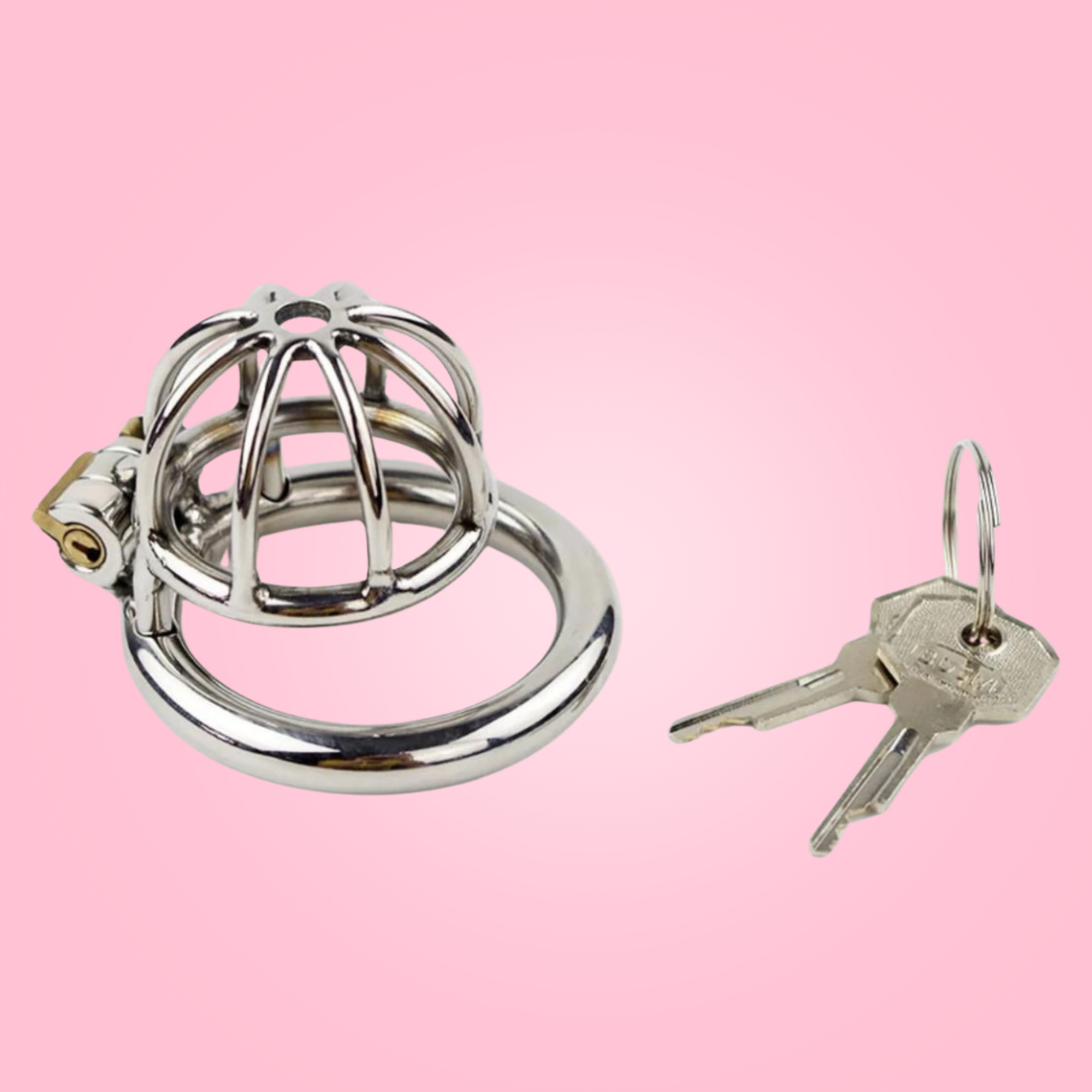 A stainless steel chastity cage in extra small size. The head is designed in an spaced, umbrella bar design and has a centre hole to allow a urethral tube to be attached if desired. The cage has one ring, that the cage attaches to and when joined, the integral lock can be fixed into place. It comes with one lock and 2 keys.