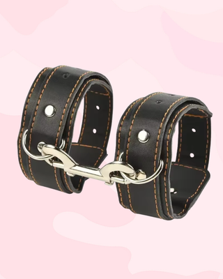 The adjustable length wrist cuffs are shown here clipped to each other