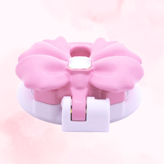 A flat view of the pink and white cage from the top of the cage