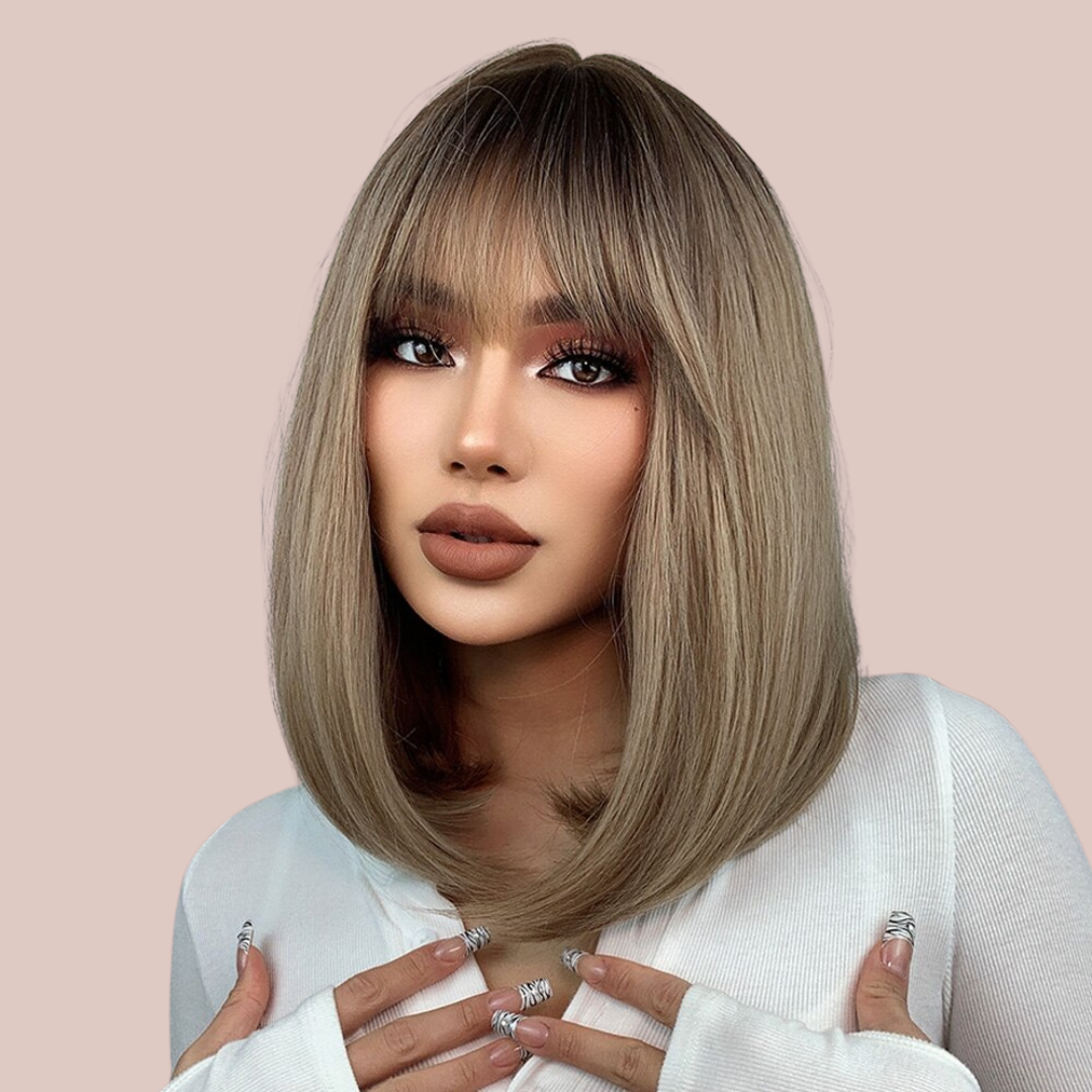 The dark blond long straight wig being modelled, you can see the long fringe that has been softly styled.