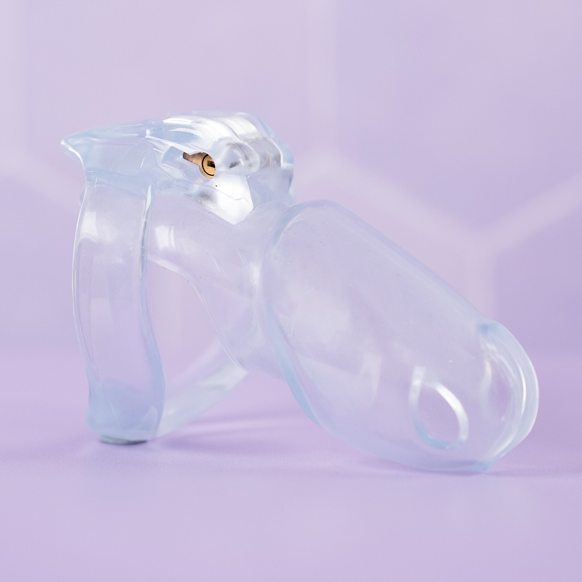 A side view of the HT V4 Transparent chastity cage fully assembled from a side view.