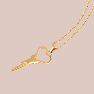 a close up of the heart key and delicate chain.