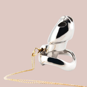 The gold key pendant and chain work well as a necklace, but it also locks or unlocks chastity cages with an integral lock.