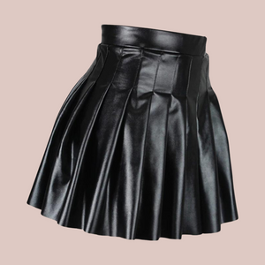 An angled view of the high waisted PU Leather skirt, showing that the pleats run the whole way round.