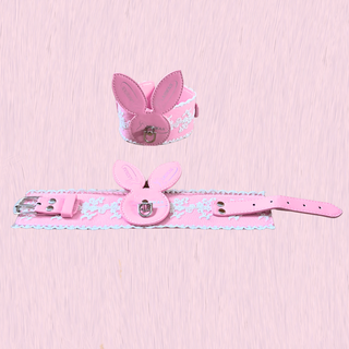 The wrist cuffs shown on a pink background