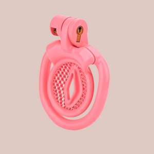 A side view of the Inverted Sissy Pussy chastity cage, you can see the Design 1 inverted face with mesh effect surround. The chastity cage is shown with its base ring and integral lock in place