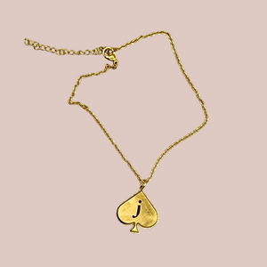 An image of the Jack of Spades bracelet or anklet, you can see the gold spade shaped pendant and delicate chain.