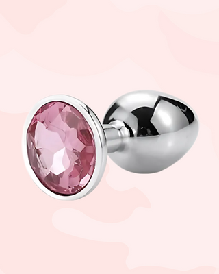 Jewelled Butt Plug with pink gemstone on a pink background