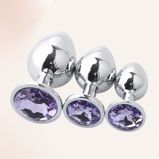 The Jewelled Butt Plug Set with violet base shown in all three sizes in the set.