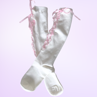 The knee high socks lying on a purple background