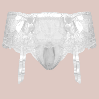 A close up of the white suspender belt and panties set for men, you can see how delicate the lace is and the pretty matching white bows.