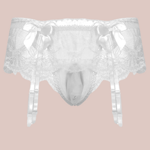 A close up of the white suspender belt and panties set for men, you can see how delicate the lace is and the pretty matching white bows.