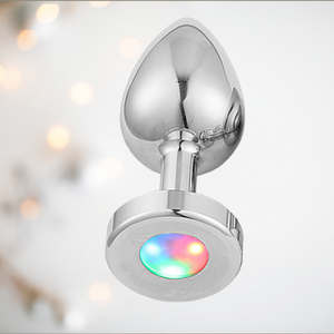 An alternate angle of the Light-Up touch anal plug from House Of Chastity. You can see the anal plug for inserting and the light-up end.