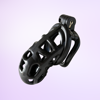 An angled view of the fully assembled chastity cage, it is shown on a purple background