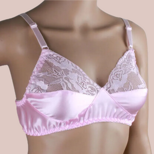 an angled view of the bra, you can see the lace detailing to the cup of th ebra and the satin fabric tha truns around the chest and into half of th ecup.