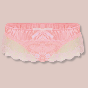 The peach satin panties from House of Chastity, these are roomier panties designed to have space at the front, they have a lace skirt and thong back