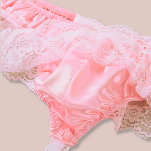 an alternate view of the peach satin panties from House Of Chastity, this image shows the roomy front of the panties.