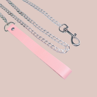 The pink handle and silver chain lead.