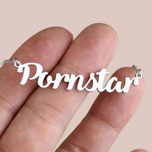 The Pornstar necklace shown  in silver, you can see the pendant lettering close up.