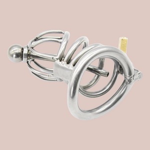 An angled view of The Prison Bird Standard with removable urethral tube. it  is shown here fully assembled and with the base ring showing and the bottom of the urethral tube.