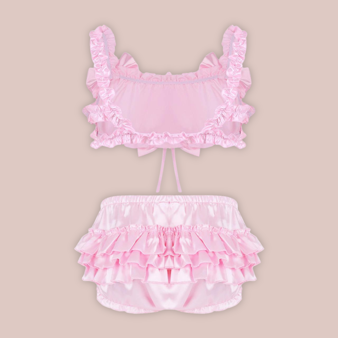 A rear view of the  pink Frilly Satin Bra Top & Panties from House Of Chastity. You can see the decorative bows and ruffled skirt.