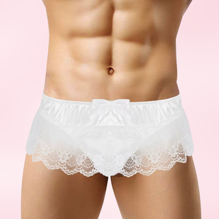The white panties being modelled and shown on a pink background