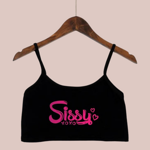 The black crop top camisole from House Of Chastity, shown on a hanger, you can see bold pink Sissy xoxo lettering.