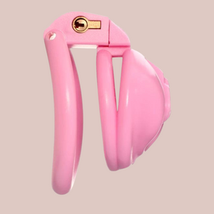 A full side view of the pink Sissy Pussy cock cage, it shows the chastity device fully assembled with the chastity cage face, base ring and integral lock in place.