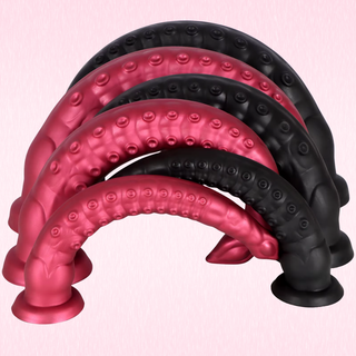 All sizes and colours of the Slimline Flexible Octopus Dildo suctioned to the floor and bent to show their flexibility.