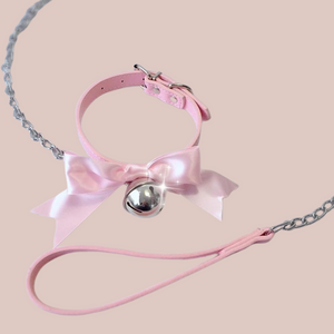 Shown is the pink satin soft collar with the bell and lead.