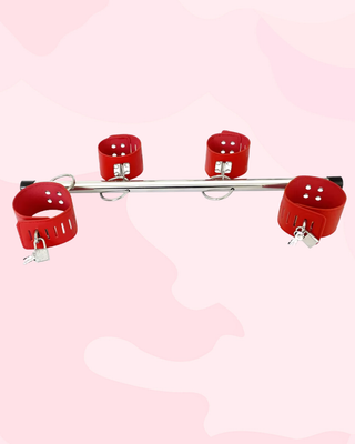 The Tease and Tether Spreader bar shown with the fixed wrist and ankle straps.