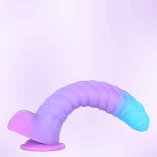 The dildo is bending to show how malleable it is, it is  shown on a purple background