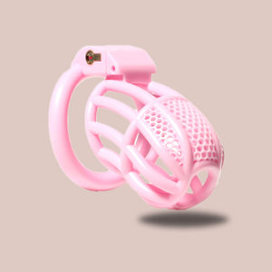 The Pink Detained Chastity Cage, you can see the lined body with the mesh affect to the top. The chastity cage is fitted to its base ring and the integral lock is in place.