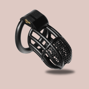 The Black Detained Chastity Cage, you can see the lined body with the mesh affect to the top. The chastity cage is fitted to its base ring and the integral lock is in place.