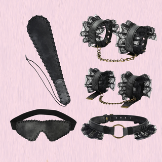 The complete bondage kit shown on a pink background