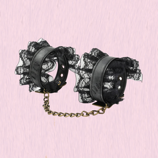 the ankle cuffs with non-detachable chaings and lace edging