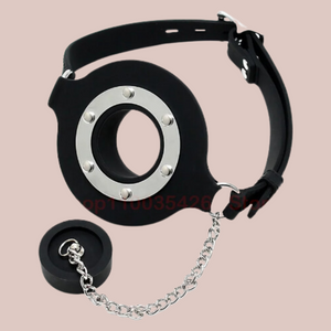 The Plug Gag is shown from the front with the plug removed, you can see how it is attached by a chain that keeps the plug in handy reach for reattachment.