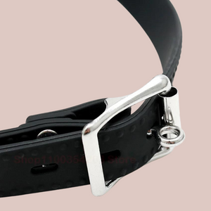 A close up view of the buckle on the head strap which shows that a padlock can be attached to lock the gag in place.