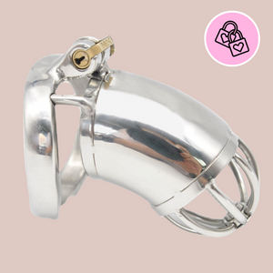 A standard size metal chastity cage with a solid shaft like centre and open bar work design to the end. The cage is shown connected to its base ring, which allows the integral lock to be fitted.
